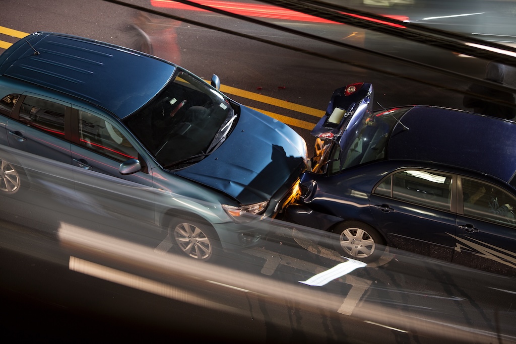 Overhead view of a car accident on a busy street, causing a Las Vegas personal injury
