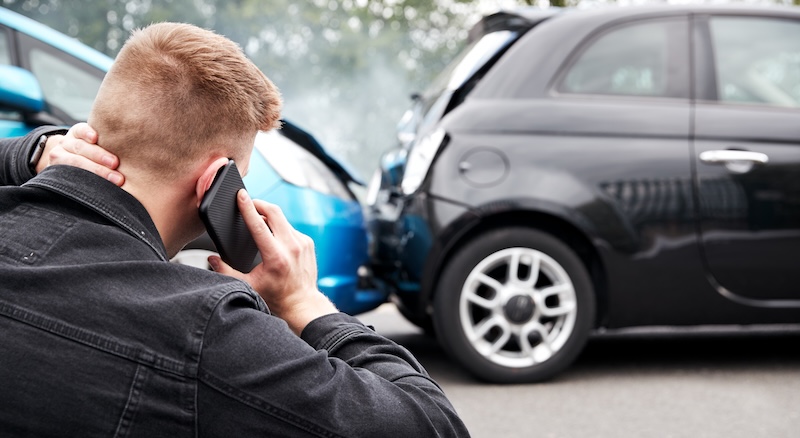 Young Male Motorist Involved In Car Accident Calling Henderson Car Accident Attorney